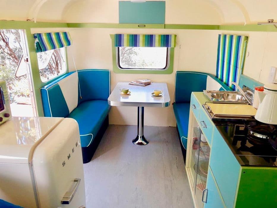 Interior of a renovated caravan with a modern and colorful atmosphere